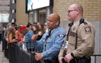 A Minneapolis police officer and a Hennepin County sheriff were on duty outside of the Armory on Friday.
