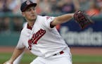 Cleveland Indians starting pitcher Trevor Bauer delivers in the first inning of a baseball game against the Minnesota Twins, Monday, Aug. 6, 2018, in 