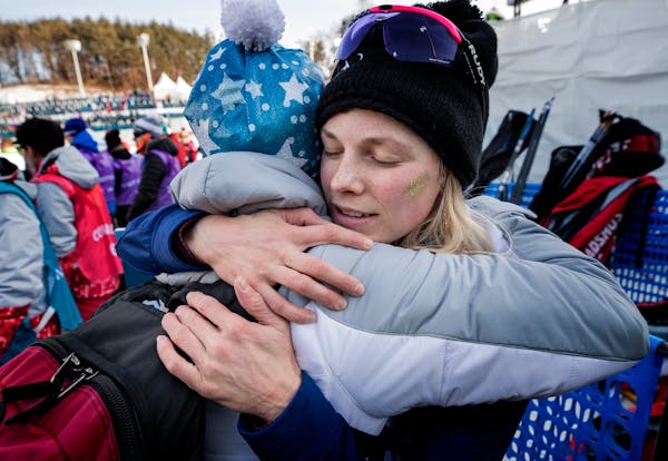 Jessie Diggins got a hug from her mother, Deb, after a race at the 2018 Winter Olympics in South Korea. Parents were not allowed to travel to the 2022