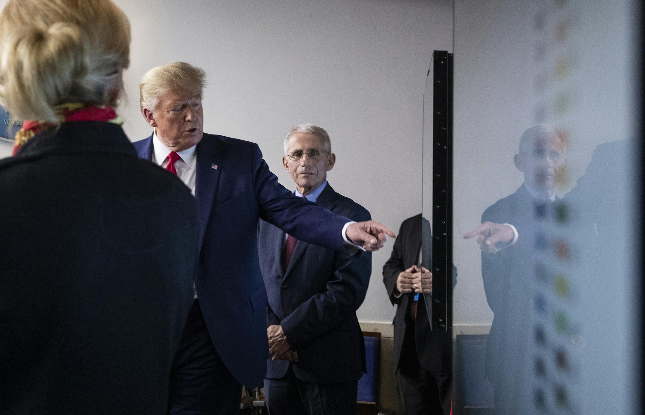 President Donald Trump gestures to a chart as he speaks about the coronavirus with Dr. Deborah Birx, White House coronavirus response coordinator, left, and Dr. Anthony Fauci, director of the National Institute of Allergy and Infectious Diseases, right, in the James Brady Press Briefing Room of the White House, Tuesday, March 31, 2020, in Washington. (AP Photo/Alex Brandon)