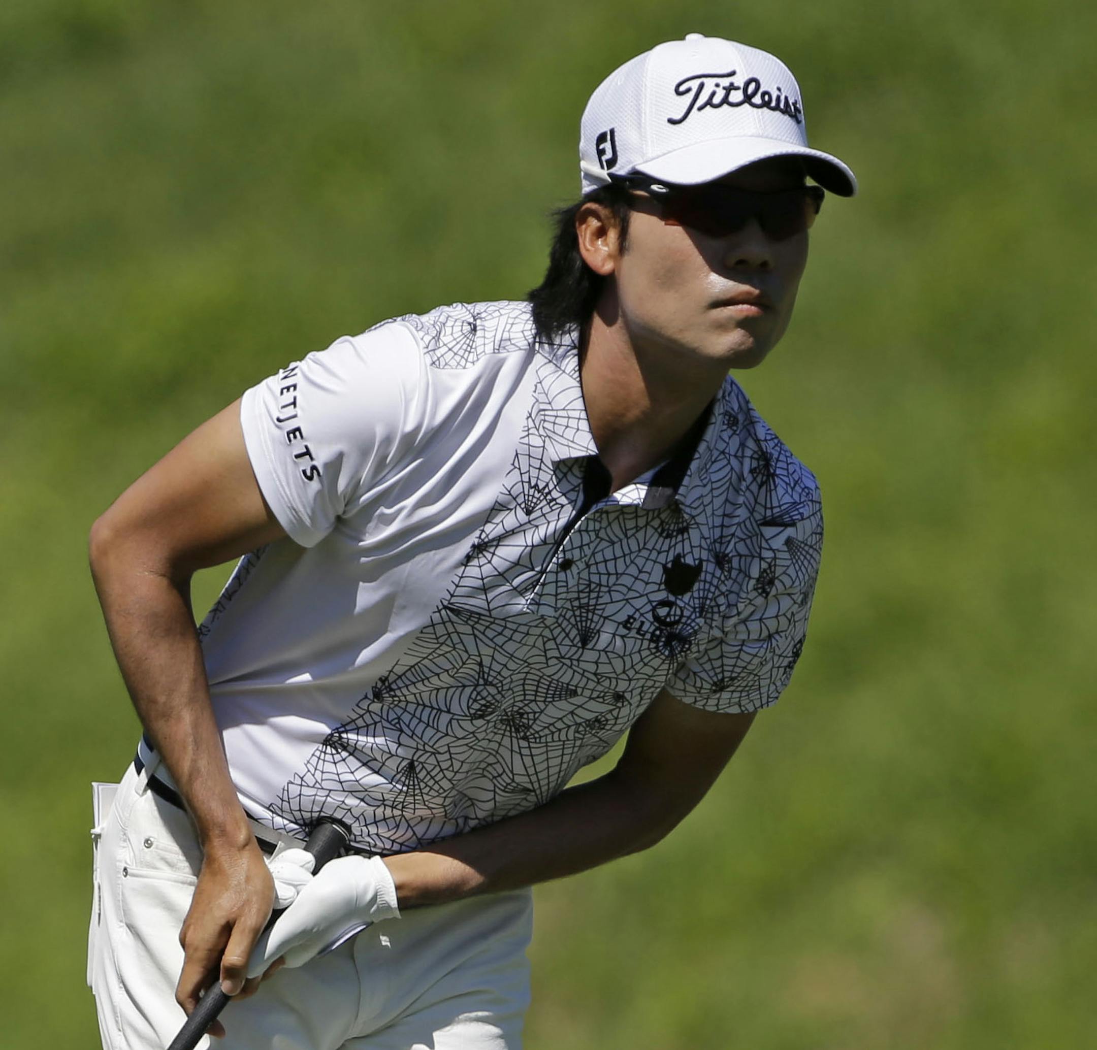 Kevin Na follows his shot from the seventh fairway, during the second round of The Players Championship golf tournament Friday, May 8, 2015, in Ponte Vedra Beach, Fla. (AP Photo/Chris O'Meara)
