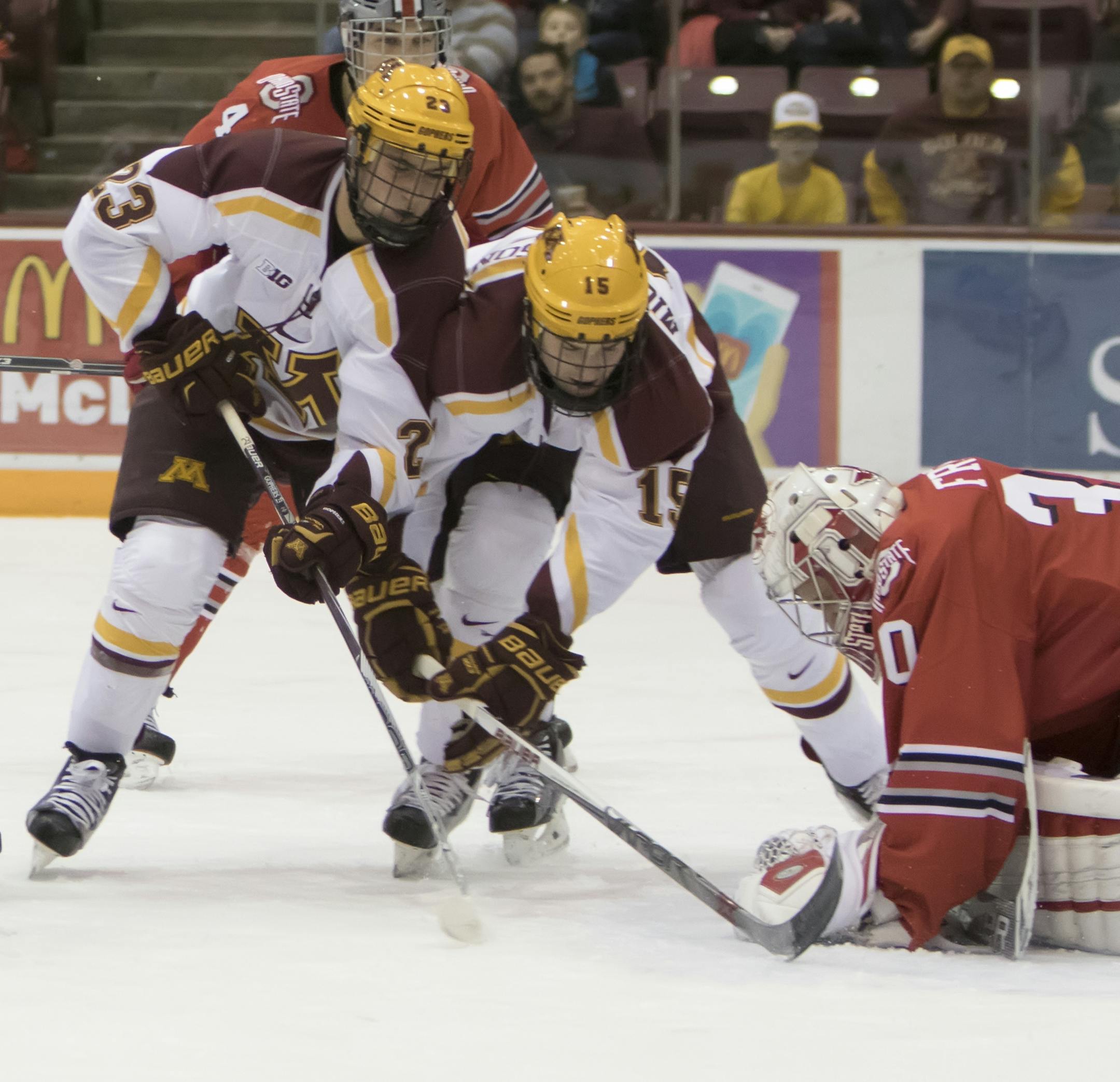 Minnesota Golden Gophers forward Jack Ramsey (16), Minnesota Golden Gophers forward Ryan Norman (23), and Minnesota Golden Gophers forward A.J. Michaelson (15) crash the net after Ohio State Buckeyes goalie Christian Frey (30) makes the save, Ohio State Buckeyes defenseman Sasha Larocque (3) and Ohio State Buckeyes defenseman Drew Brevig (4) defending as the Minnesota Golden Gophers hosted the Ohio State Buckeyes to open the Big Ten Conference schedule on December 4, 2015. ] Special to Star Trib