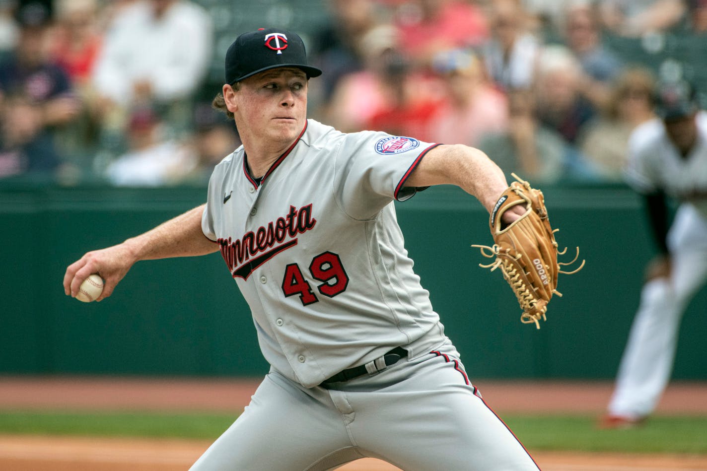 Minnesota Twins starting pitcher Louie Varland delivers against the Cleveland Guardians during the first inning of the first game of a baseball doubleheader in Cleveland, Saturday, Sept. 17, 2022. (AP Photo/Phil Long)