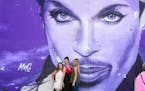 Rachel Omodt, Mandy Lindberg and Paige Wilson posed for a photo by the Prince mural.