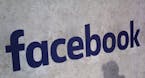FILE - This Jan. 17, 2017, file photo shows a Facebook logo displayed in a start-up companies gathering at Paris' Station F in Paris. Facebook says it
