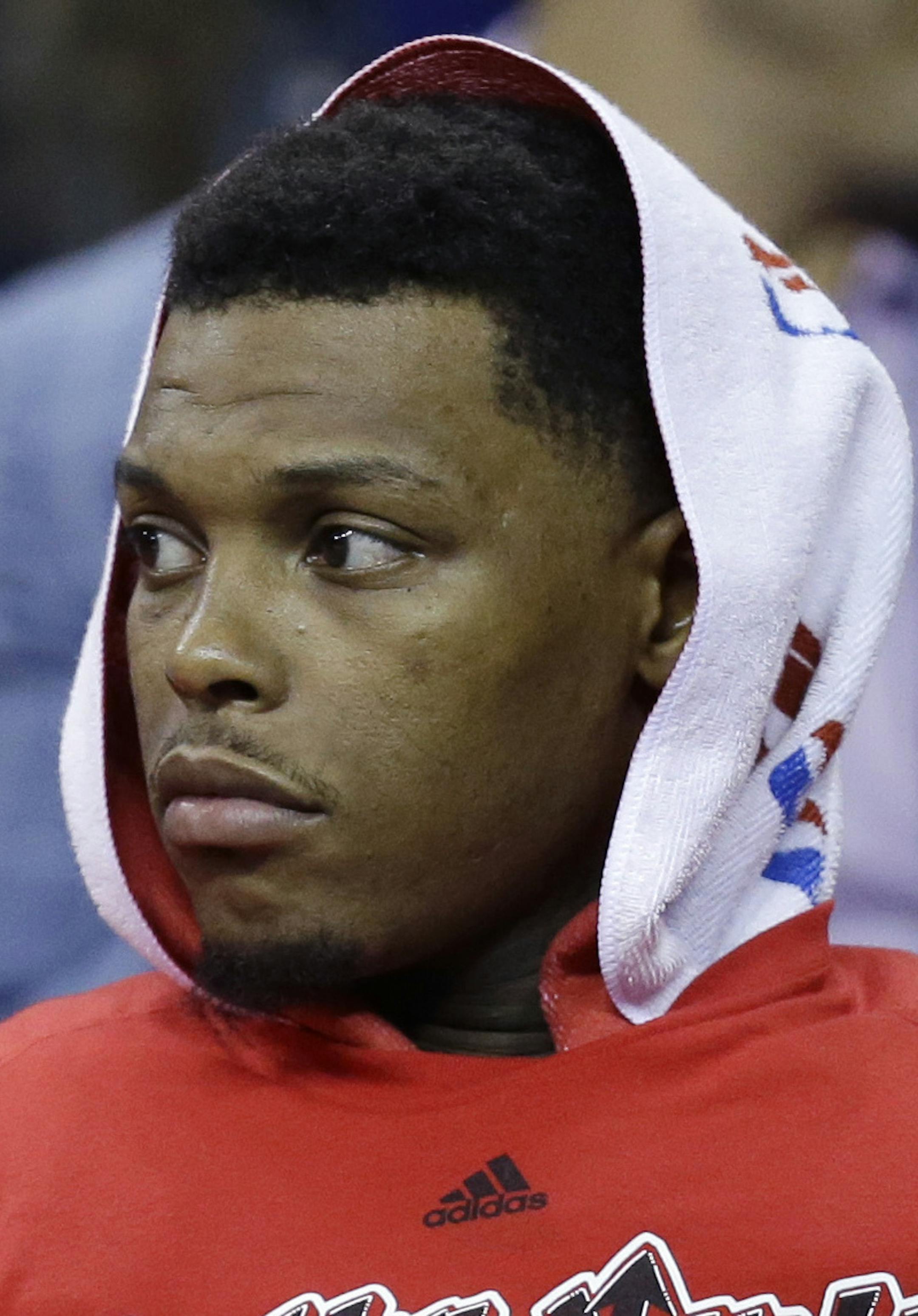 Toronto Raptors' Kyle Lowry sits on the bench during the closing minutes of the team's 115-84 loss to the Cleveland Cavaliers in Game 1 of the NBA basketball Eastern Conference finals, Tuesday, May 17, 2016, in Cleveland. (AP Photo/Tony Dejak)