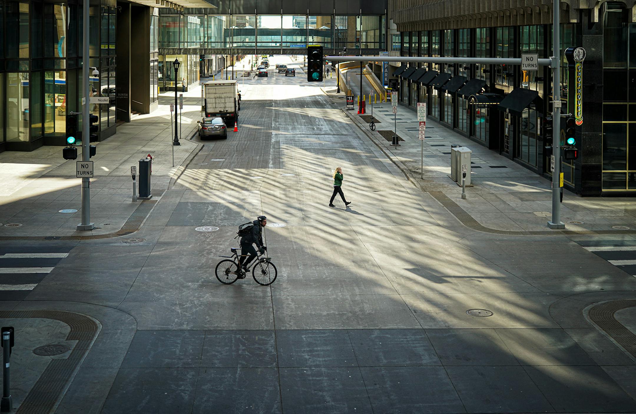 A few people were still moving around in downtown Minneapolis but nothing near the lunch hour weekday crowds along 8th Street at Nicollet Mall.