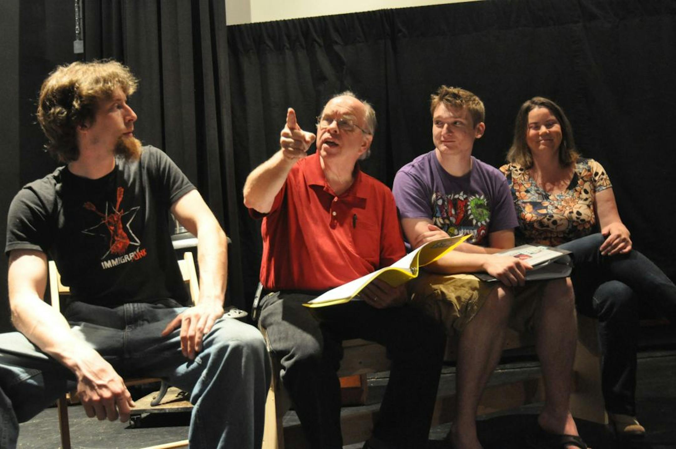 (left to right) Nick James of Eagan, Rosemount playwright Keith Reed, Shane Donahue of Hudson, and Patience Hughes of St. Paul rehearsed for Reed�s production of �The Murdered Minstrel of Toil: the Joe Hill Story.�