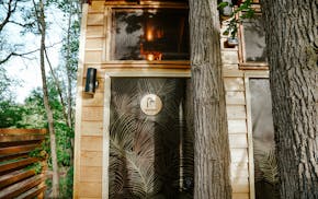 "Bungalow" guests at Cuyuna Cove have access to a shower house inspired by an outdoor spa.