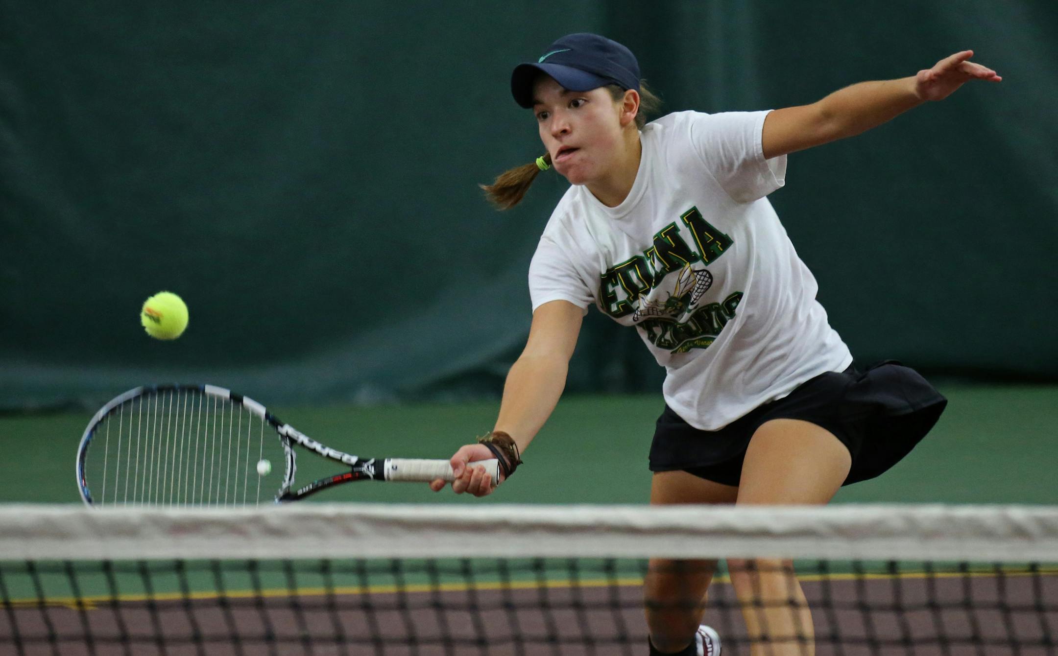 Edina's Caitlyn Merzbacher hit the game winning volley over the net to beat returning champion Summer Brills of Mounds View in the girls high school singles finals, at Baseline Tennis Center on 10/25/13.] Bruce Bisping/Star Tribune bbisping@startribune.com Caitlyn Merzbacher, Summer Brills/roster. ORG XMIT: MIN1310251547392714