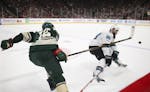 Wild center Eric Staal poked the puck past Sharks defenseman Brent Burns at mid-ice before breaking away with it for an empty-net goal in the third pe