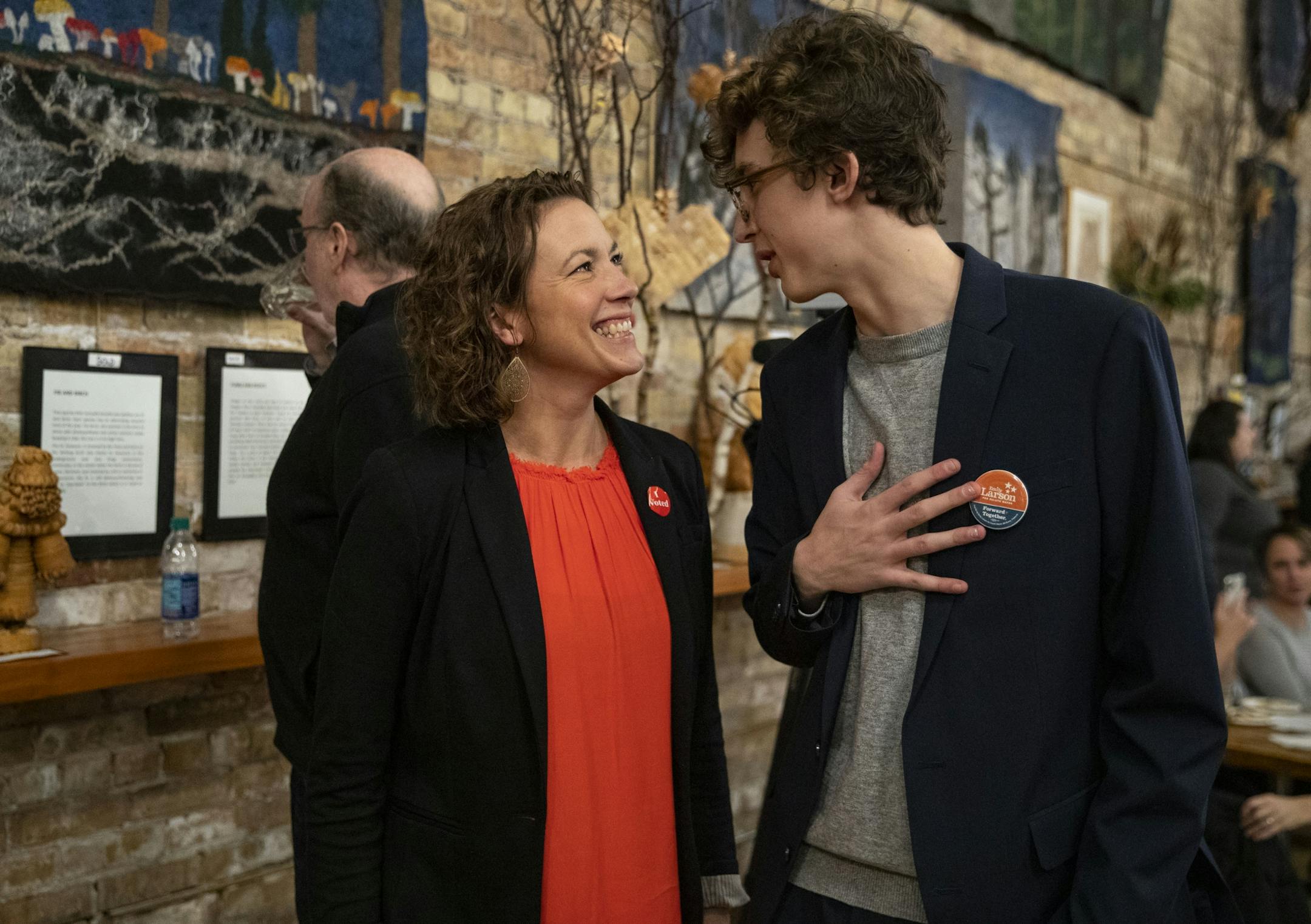 Duluth incumbent Mayor Emily Larson talked with her son, Eli Zaun, after the results for her election came in, declaring Larson the winner at her watch party at the Duluth Folk School on Tuesday night.