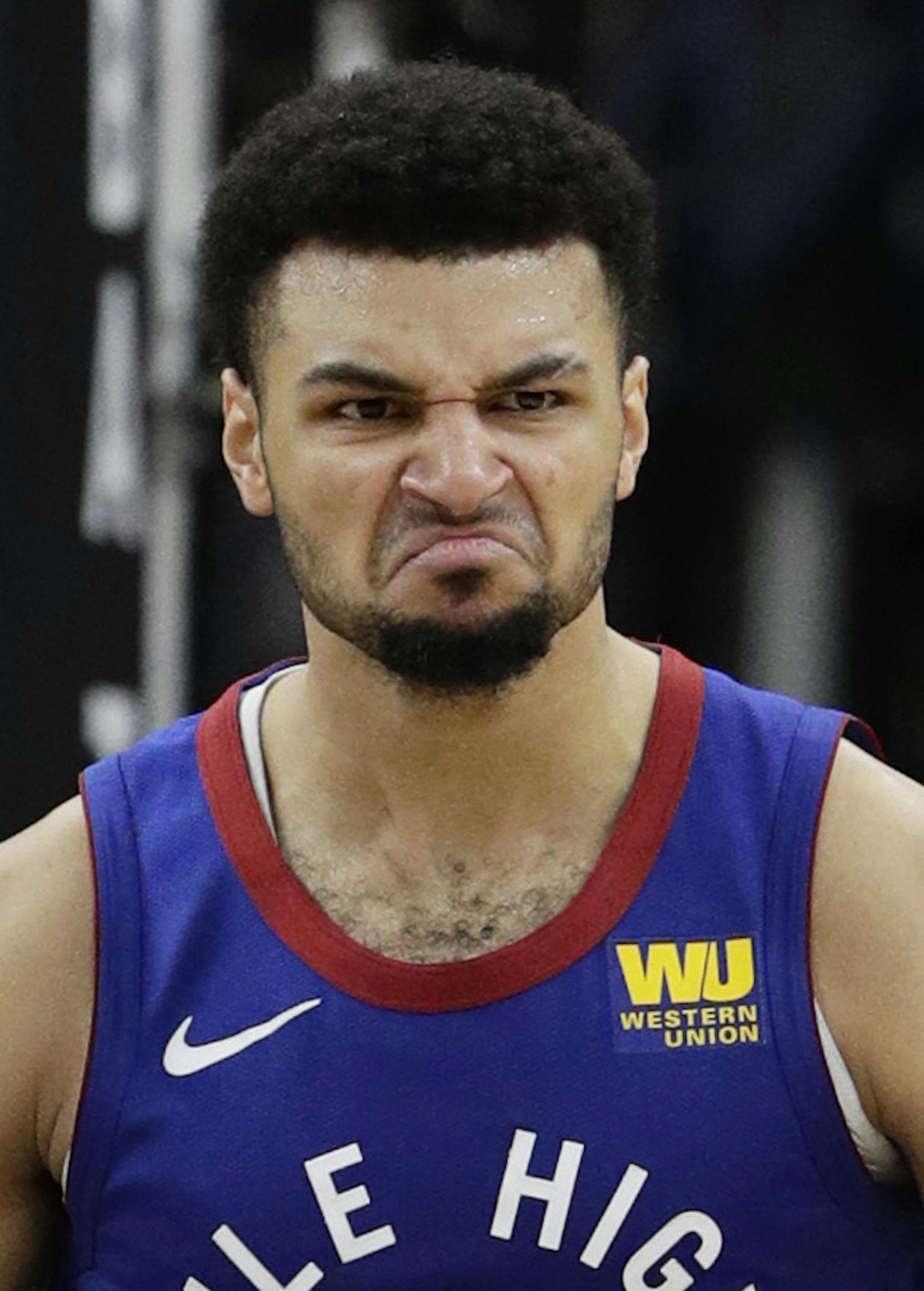 Denver Nuggets guard Jamal Murray (27) reacts after scoring against the San Antonio Spurs during the first half of Game 4 of an NBA basketball playoff series, in San Antonio, Saturday, April 20, 2019. (AP Photo/Eric Gay)