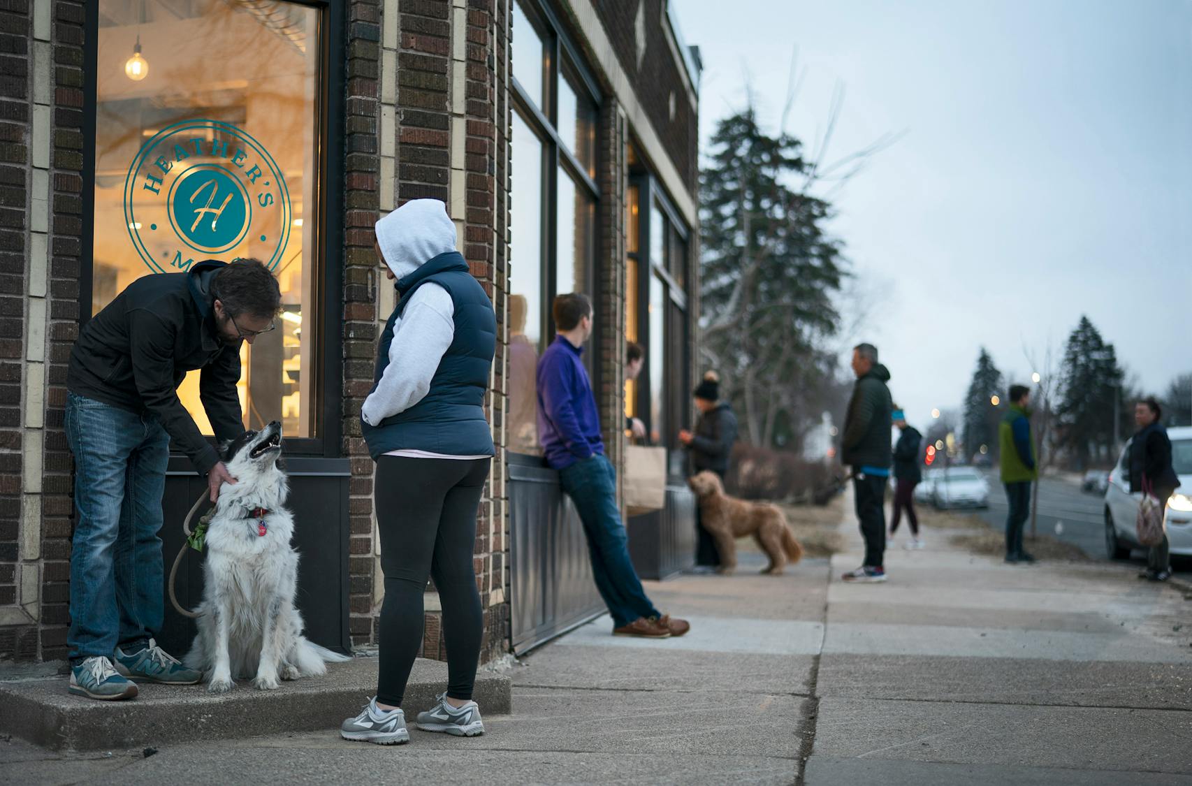 Customers waited for takeout orders outside Heather's restaurant in south Minneapolis.