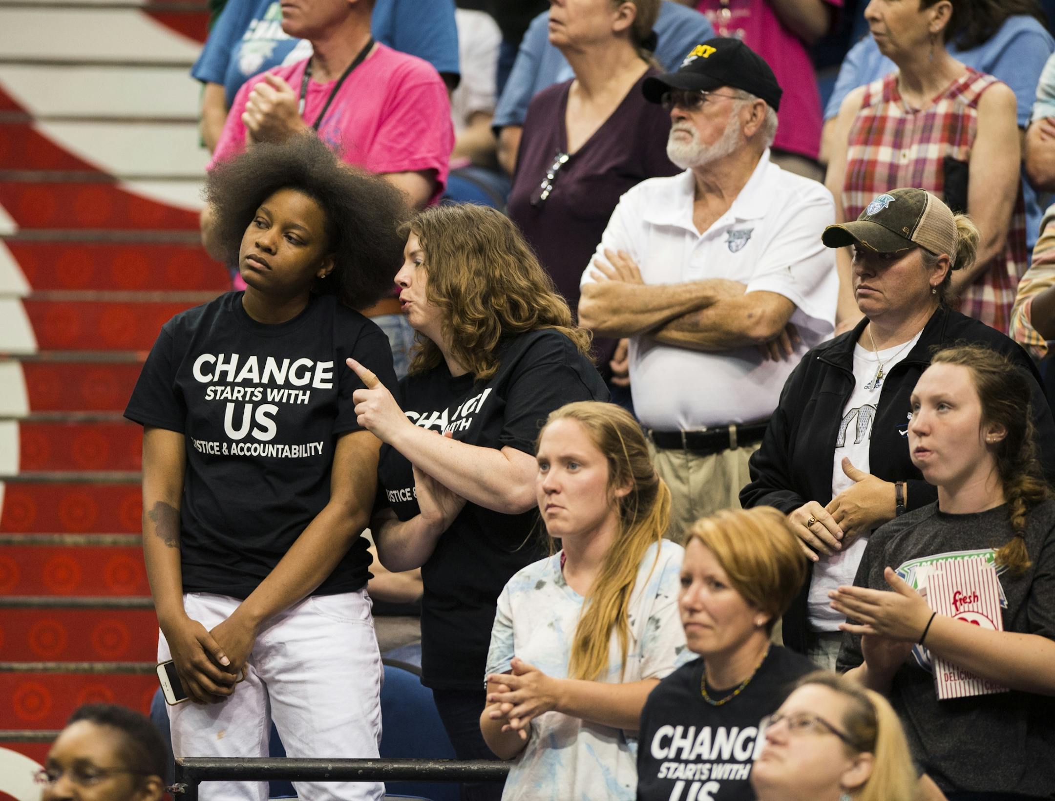 Spectators wearing shirts calling for police accountability stood in the crowd before Friday night's Lynx game.