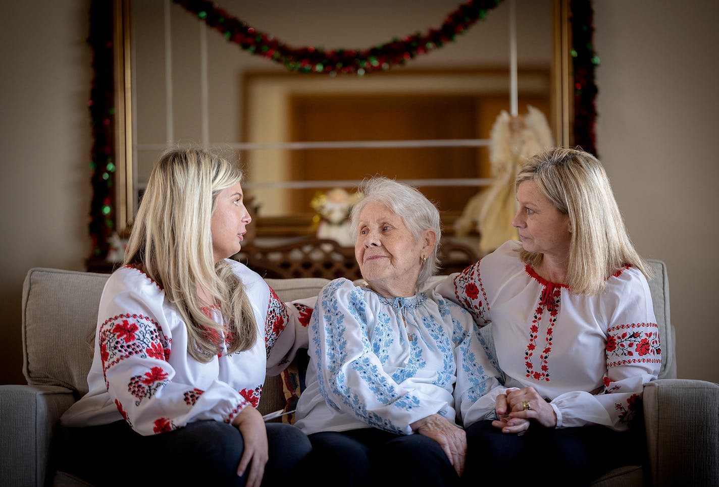 Nina Thueson, left, her grandmother Nina Jablonsky, center, and Nina's mother Luba Thueson, right, share history of Jablonsky's journey from the Ukraine to Minneapolis at her home in Minneapolis.