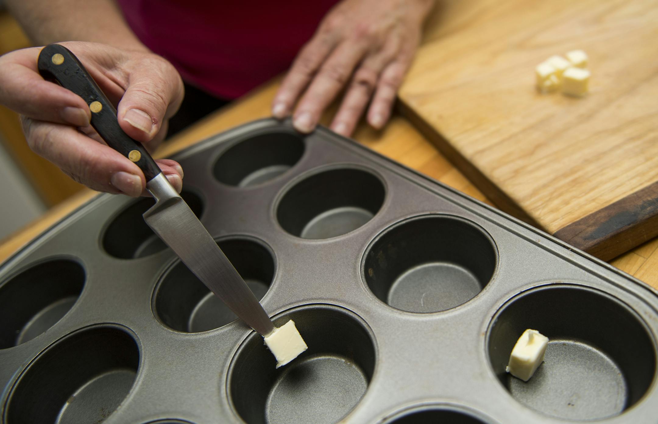 Step 1: place butter into muffin tin, melt in oven before pouring in batter. ] Isaac Hale ï isaac.hale@startribune.com Baking Central: Making Dutch Puffs in muffin tin and blueberry compote on Wednesday, July 13, 2016.