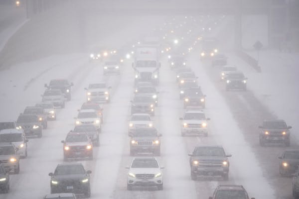 Rush hour traffic traveled southbound on Interstate 35W in Minneapolis as a winter storm hit the Twin Cities Tuesday afternoon.