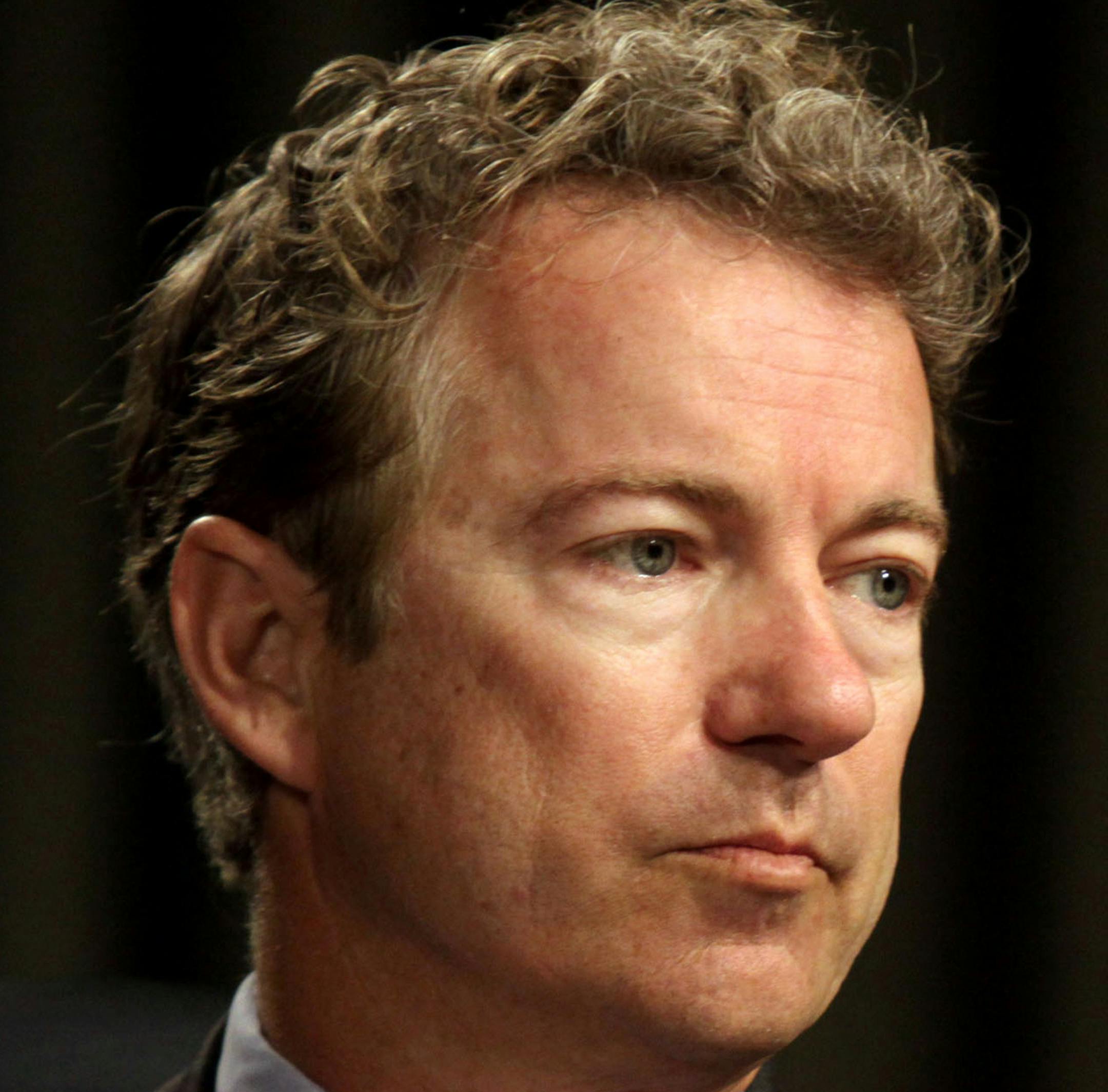 FILE - In this April 1, 2014 file photo, Sen. Rand Paul, R-Ky. listens on Capitol Hill in Washington. Paul is taking online digs at potential GOP rival Sen. Marco Rubio, R-Fla. over President Barack Obama's new Cuba policy. (AP Photo/Lauren Victoria Burke, File)