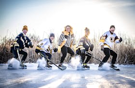Zam, Victor, Kristi, Max and Derek Plante posed for a pond hockey picture. Derek was an All-America player at UMD, where Kristi was a standout athlete