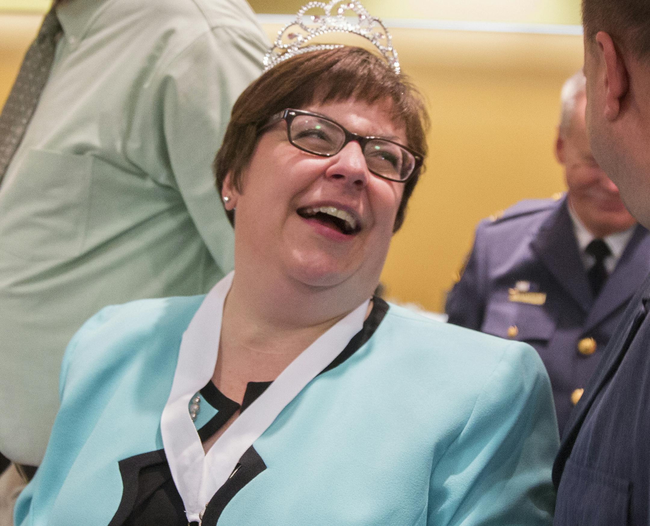 St. Paul Police civilian employee of the year Angela Anderson greets friends after the St. Paul Police Award Ceremony recognizing the officer, detective and civilian employees of the year at the Holiday Inn on Burns Avenue in St. Paul on Wednesday, April 8, 2015. ] LEILA NAVIDI leila.navidi@startribune.com /