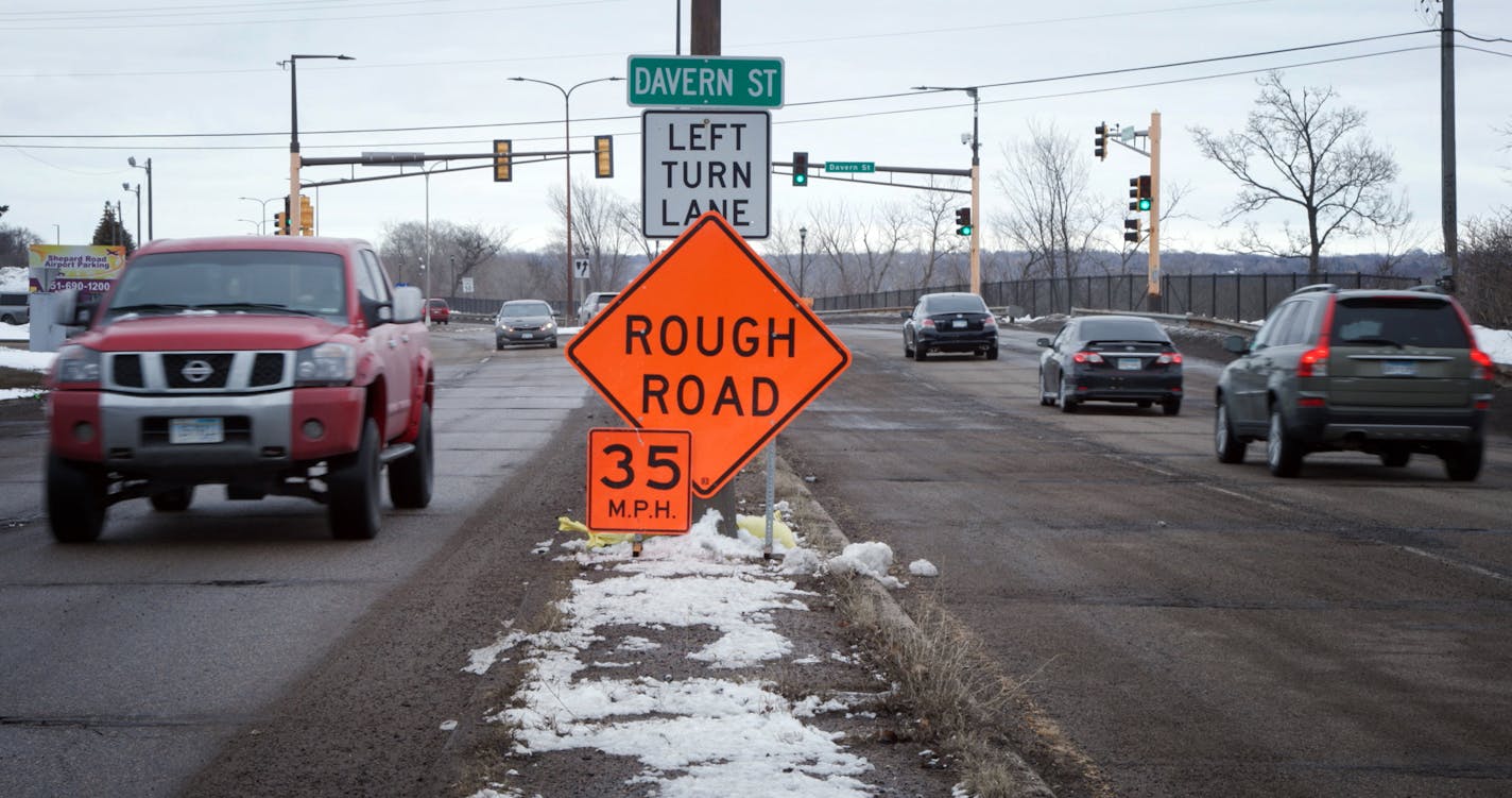 Shepard Road in St. Paul was reduced from 50 to 35 MPH because of all the potholes, cars are seen driving on Shepard Road near Davern Street on Friday, March 10, 2023. ] MATT GILLMER • matt.gillmer@startribune.com