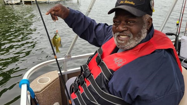 A participant from the Minnesota Veterans Home in Minneapolis showed off his “trophy” sunfish.
