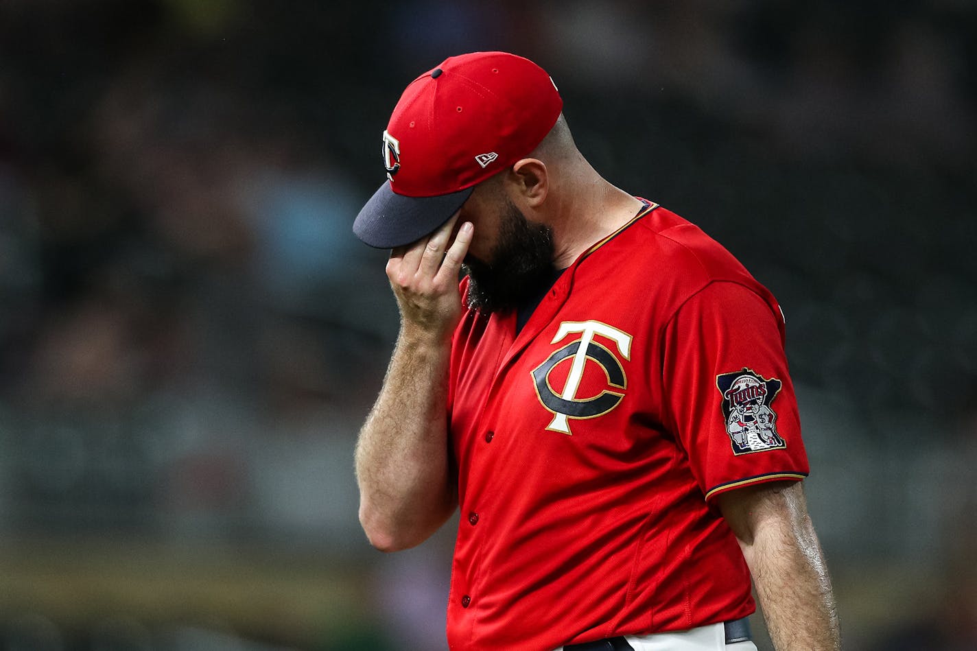 Matt Shoemaker walks to the dugout after giving up two runs to the Astros in the ninth inning