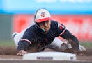 Twins left fielder Trevor Larnach, diving into third base during a game at Target Field on April 22, has carved out an everyday role in the major leag