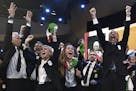 Members of Milan-Cortina delegation celebrate after winning the bid to host the 2026 Winter Olympic Games, during the first day of the 134th Session o