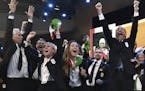 Members of Milan-Cortina delegation celebrate after winning the bid to host the 2026 Winter Olympic Games, during the first day of the 134th Session o