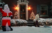 Jim Shaughnessy clears his walkway of the overnight Christmas snow at first light to prepare for the arrival of relatives at his home in Louisville, K