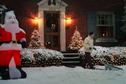 Jim Shaughnessy clears his walkway of the overnight Christmas snow at first light to prepare for the arrival of relatives at his home in Louisville, K