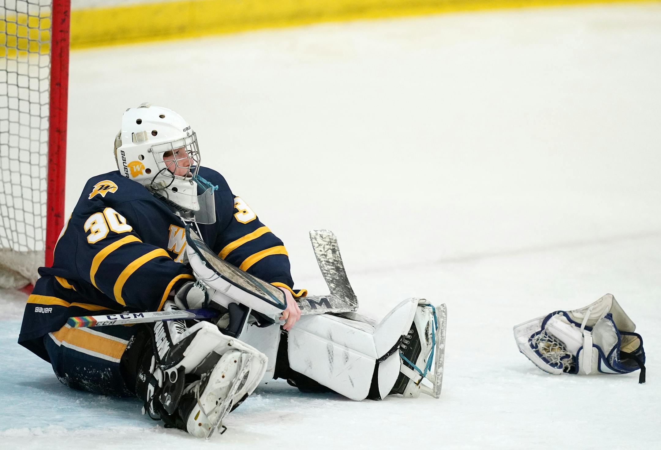 Wayzata goaltender Micah Bergeron (30) sat on the ice after she lost her glove trying to make a save in the third period. ] ANTHONY SOUFFLE • anthony.souffle@startribune.com Edina High School played Wayzata High School in a girls' hockey Class 2A, Section 6 final Friday, Feb. 14, 2020 at Parade Ice Arena in Minneapolis.