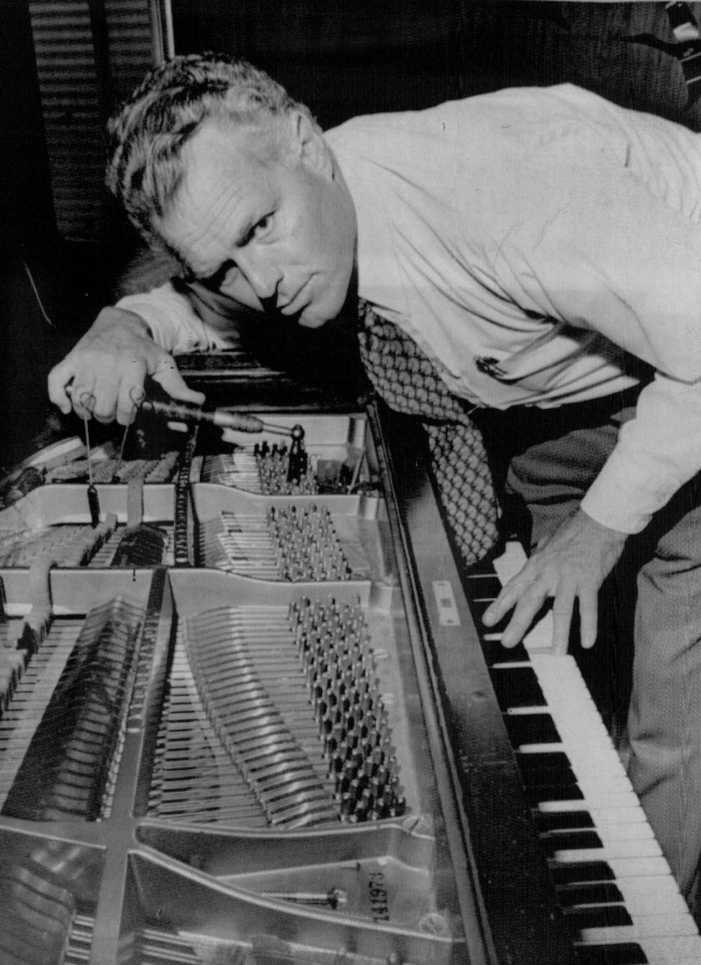 November 23, 1973 'PICASSO OF TUNERS' - Norman Neblett looked up from his work, tuning a piano for Capitol Records in Los Angeles. His colleagues cal him a "Picasso" of his trade. Tuners are a vanishing breed, he says, adding that most of America's 10.5-million pianos are out of tune. Associated Press