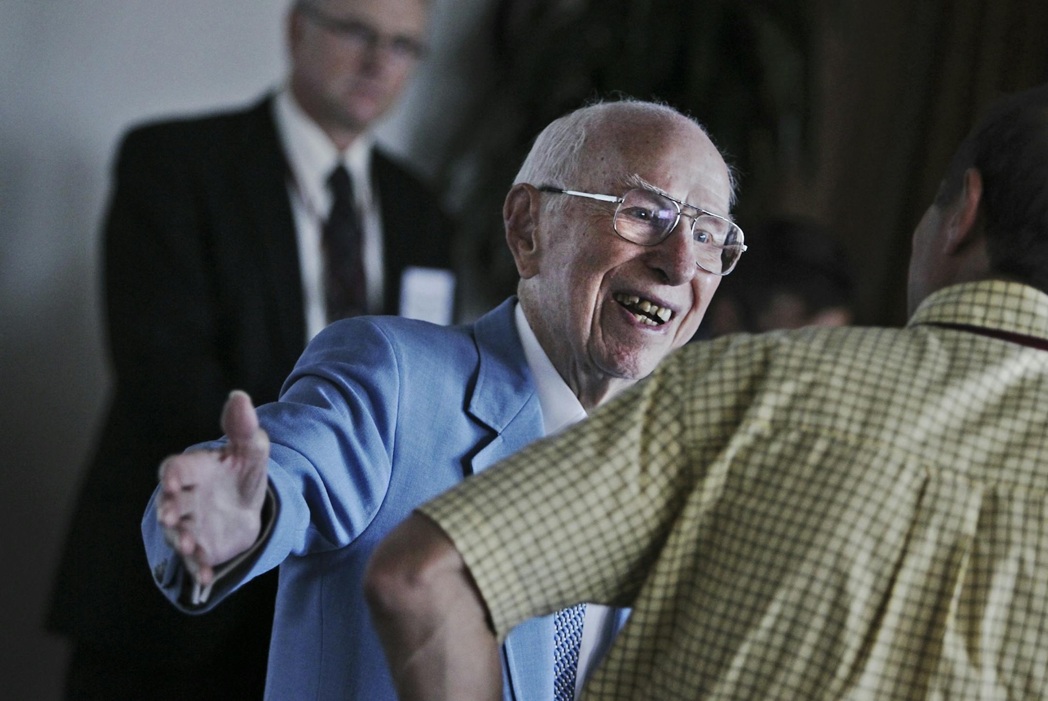 Bernie Queneau greeted Bernie Harlow at the Campus Club at the University of Minnesota on Tuesday.