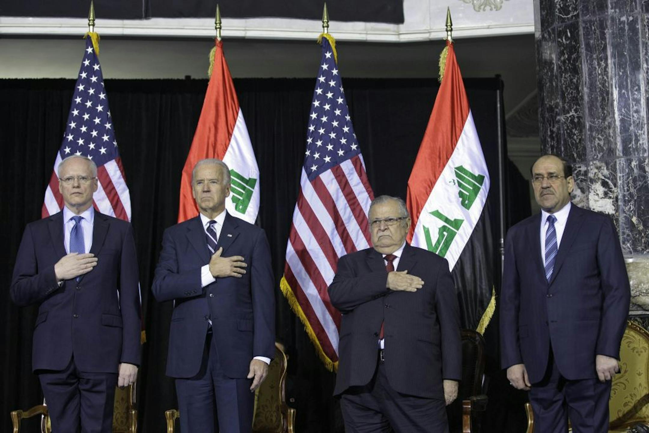From left, U.S. Ambassador James Jeffrey, Vice President Joe Biden, Iraqi President Jalal Talabani and Iraqi Prime Minister Nouri al-Maliki at Camp Victory in Baghdad.