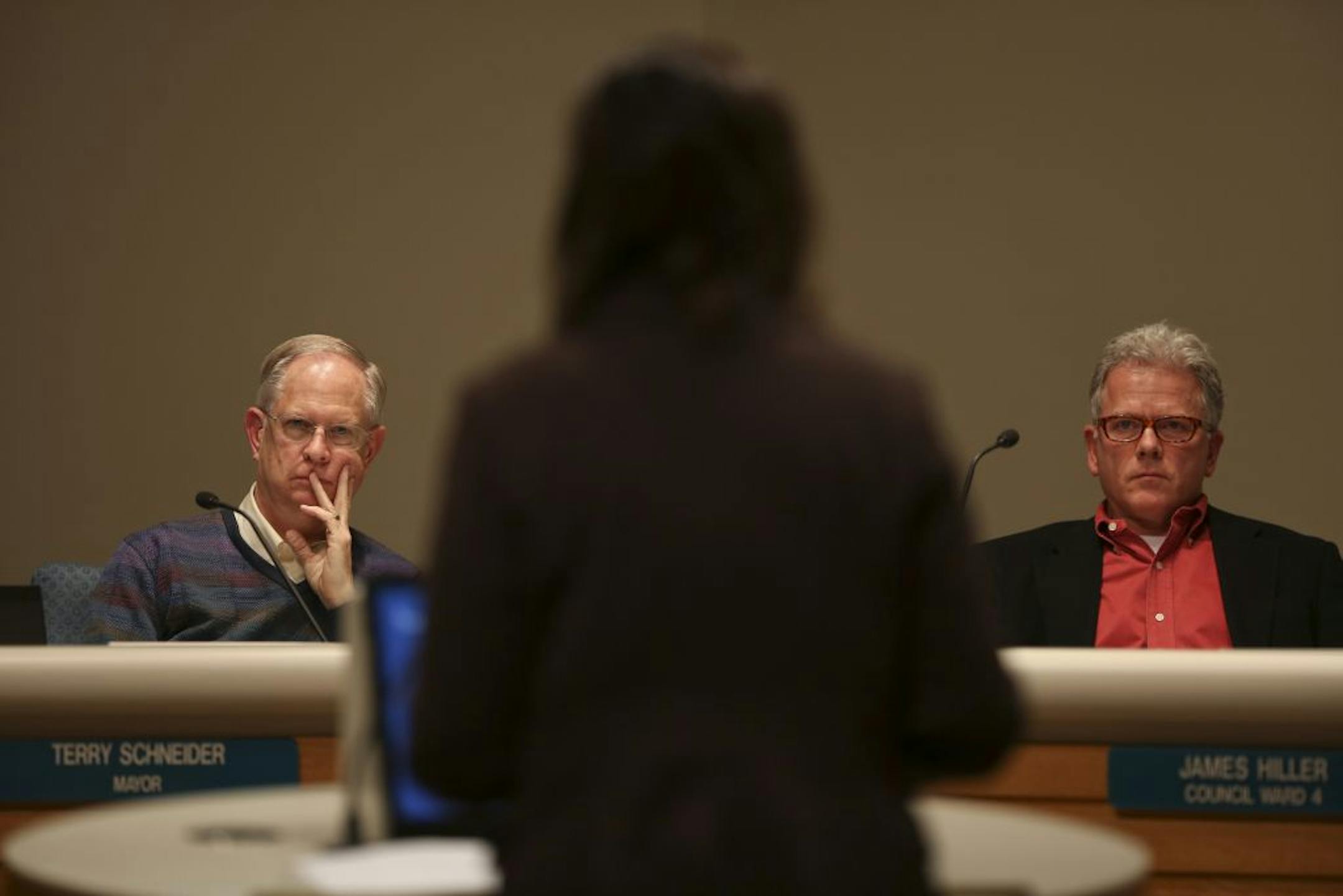 Mayor Terry Schneider and City Council Member Brad Wiersum listened as Anne Marie Hansen outlined her plans to address concerns about expansion.