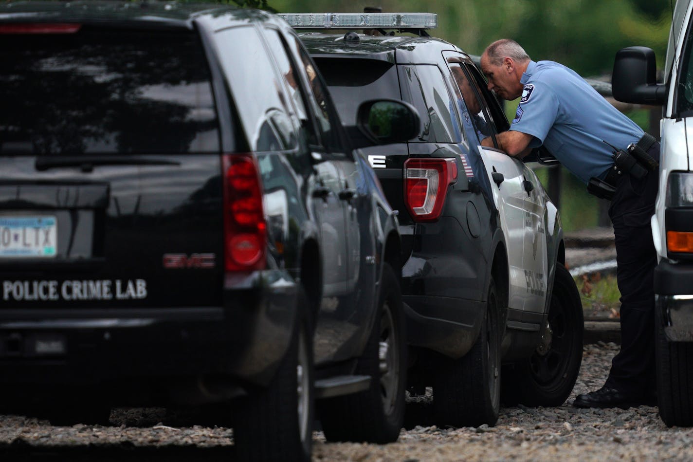 Police talked with one another as they investigated the scene where a man was found dead in the early morning hours Tuesday, Aug. 13, 2019 on the railway tracks near the intersection of 16th Avenue and NE Marshall Street. ] ANTHONY SOUFFLE • anthony.souffle@startribune.com Police investigated the scene were a man was found dead in the early morning hours Tuesday, Aug. 13, 2019 on the railway tracks near the intersection of 16th Avenue and NE Marshall Street in Minneapolis.