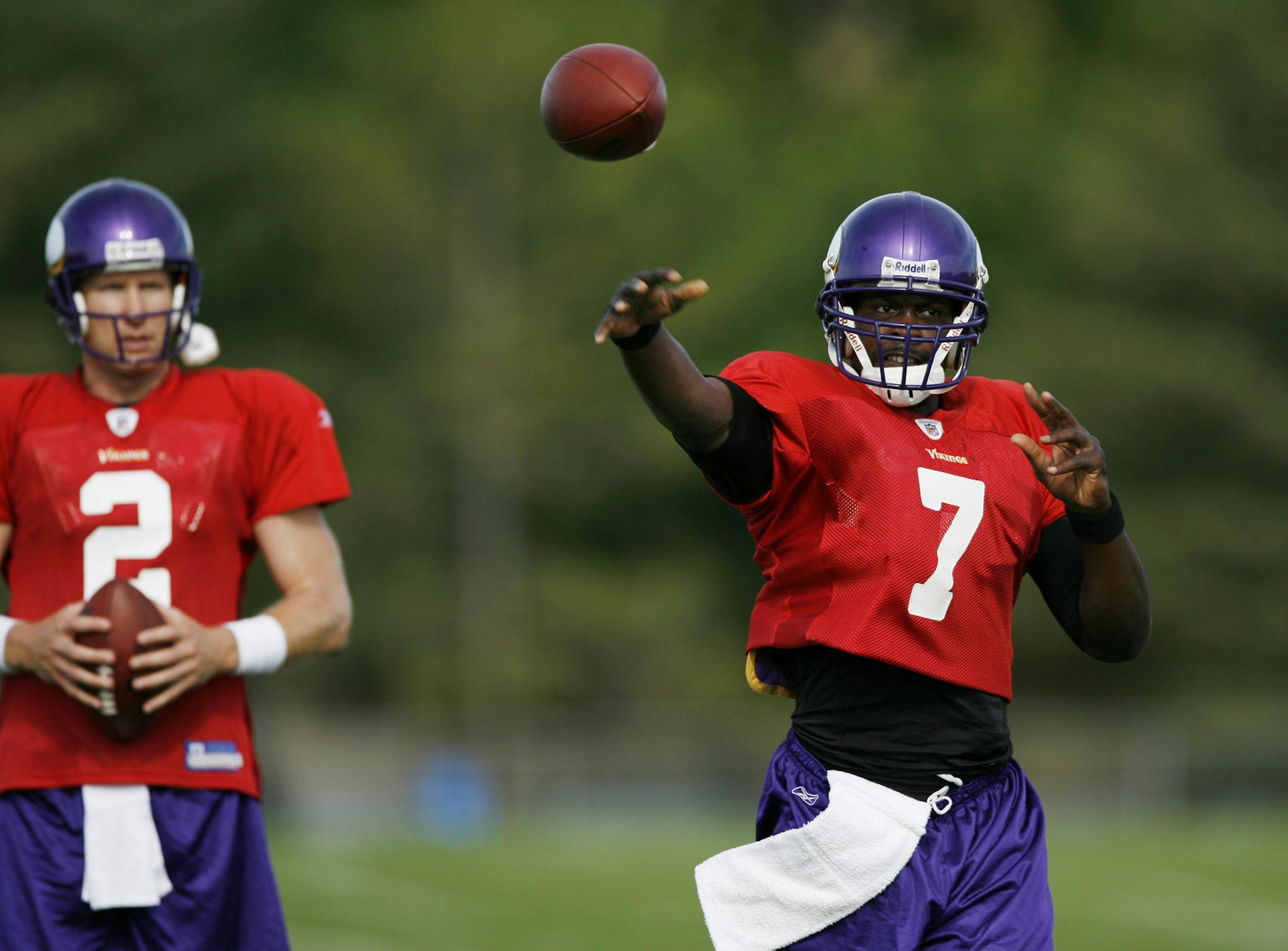 jgholt@startribune.com 7/31/2009-----] Vikings quarterback Sage Rosenfels left looks on as Tarvaris Jackson threw a pass during Friday morning practice at Minnesota State University Mankato. The two players a competing for the starting quarterback position.