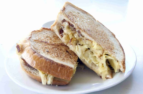 Let your tastes dictate your sandwich. This one combines smoked gouda and artichoke hearts on grilled sourdough.