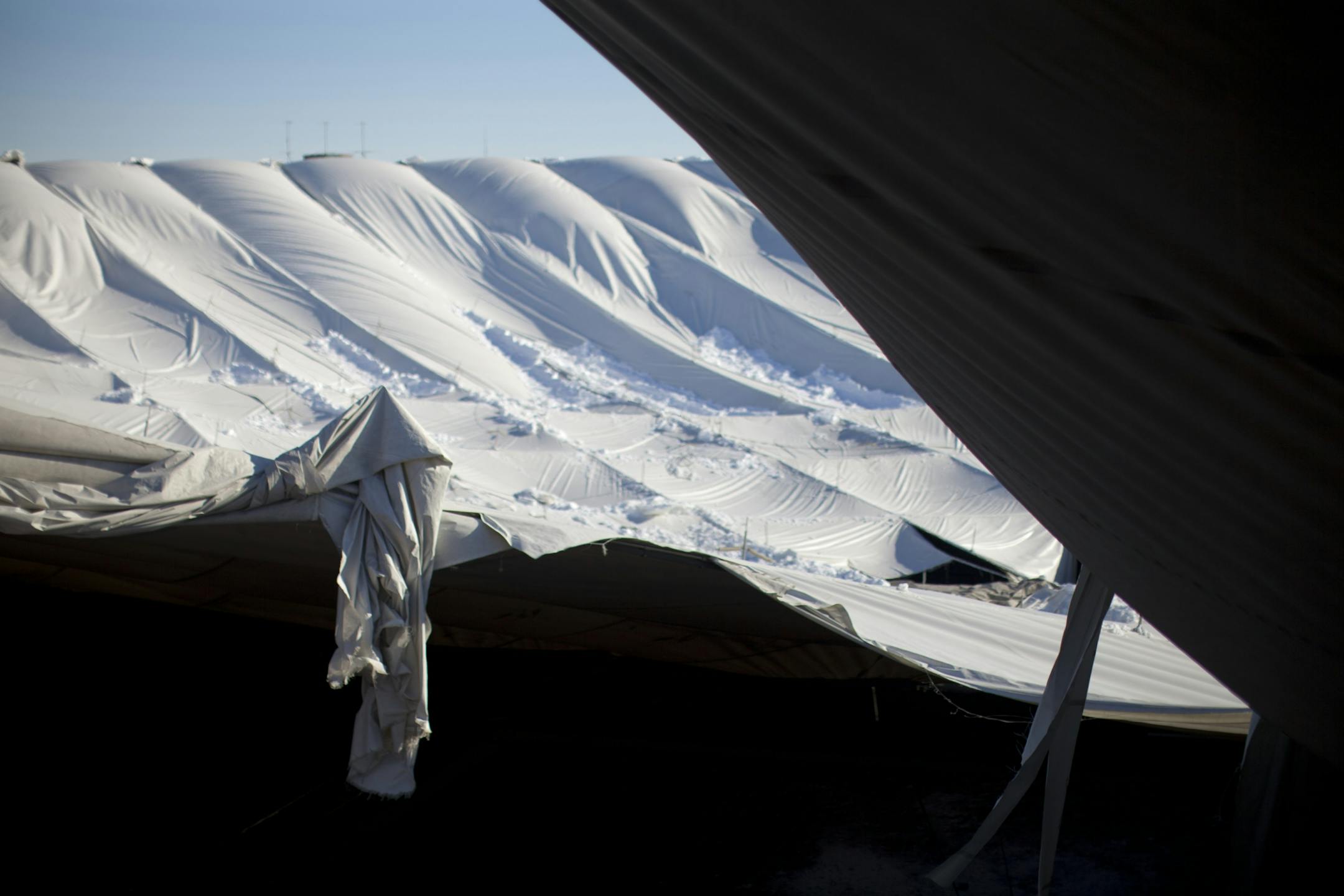 A shredded portion of the Metrodome roof Sunday morning.
