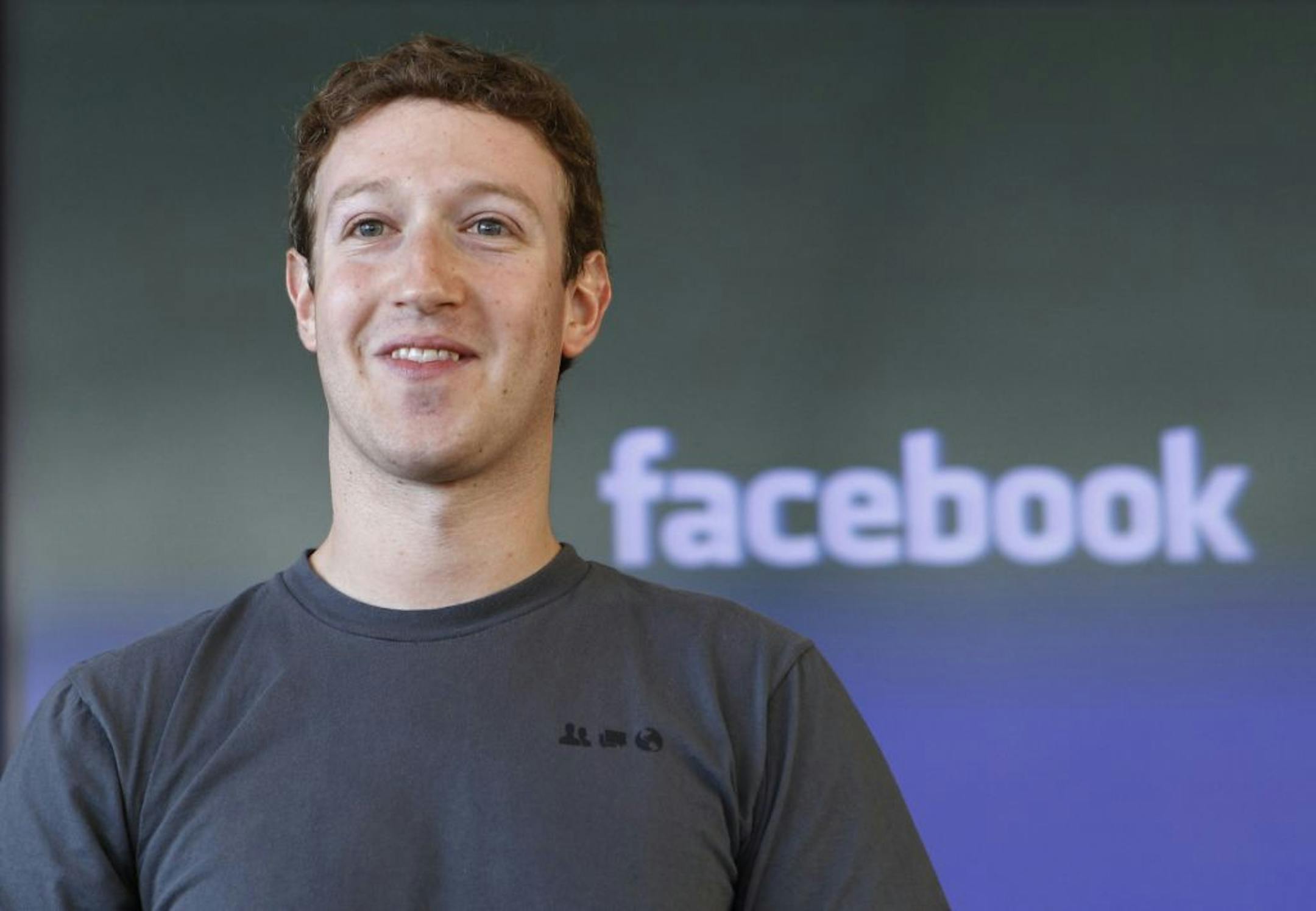 FILE - In this Jan. 3, 2011 file photo, shows Facebook CEO Mark Zuckerberg smiling in San Francisco. Zuckerberg turns 28 on Monday, May 14, 2012. He's considerably younger than the average FORTUNE 500 CEO, of course. But while some investors worry that Zuckerberg is too young to lead Facebook as a public company, experts point out that Bill Gates, Steve Jobs and Michael Dell were in their 20s when their companies had IPOs.