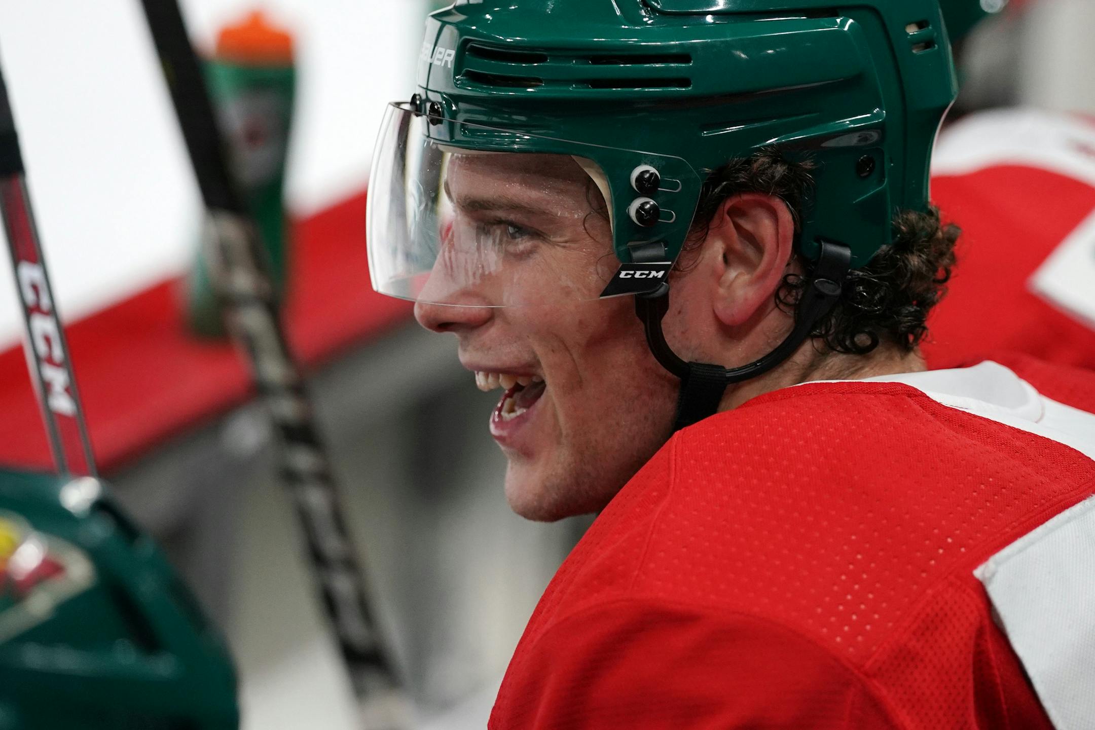 Minnesota Wild center Charlie Coyle (3) laughed from the bench between drills.