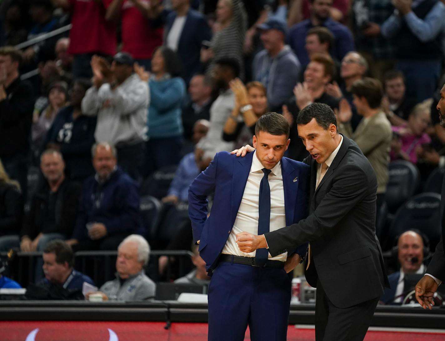 Wolves coaches Ryan Saunders, left, and Pablo Prigioni preach a system that calls for players to make decisions within a half-second.