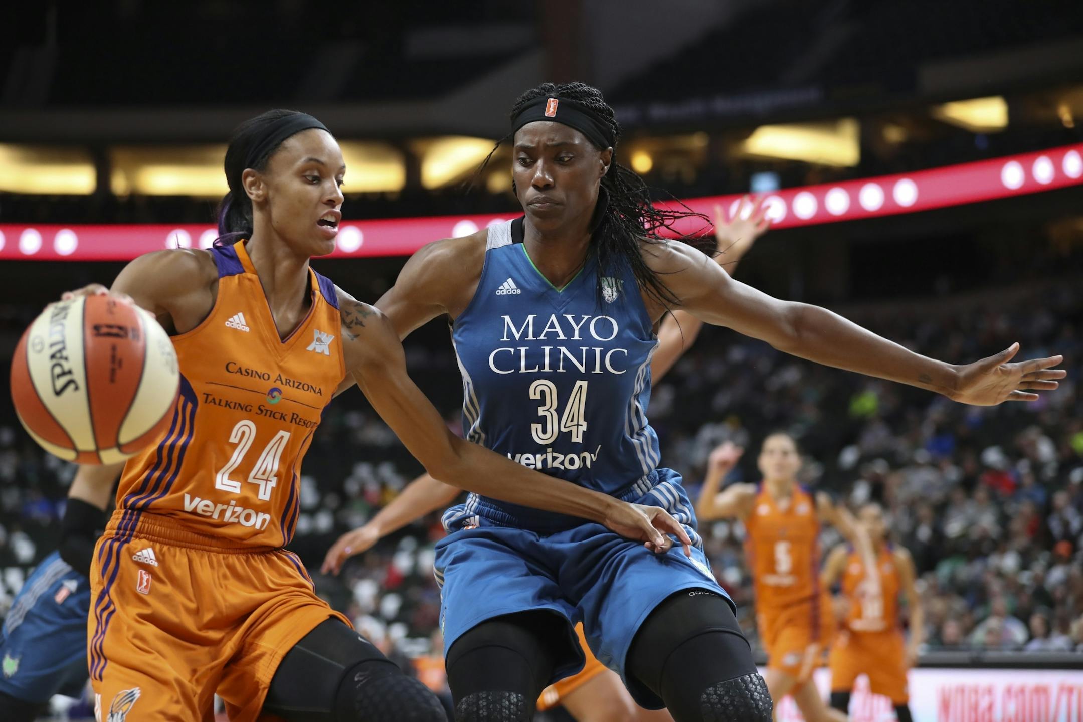 Minnesota Lynx center Sylvia Fowles (34) defended Phoenix Mercury guard DeWanna Bonner (24) in the fourth quarter.