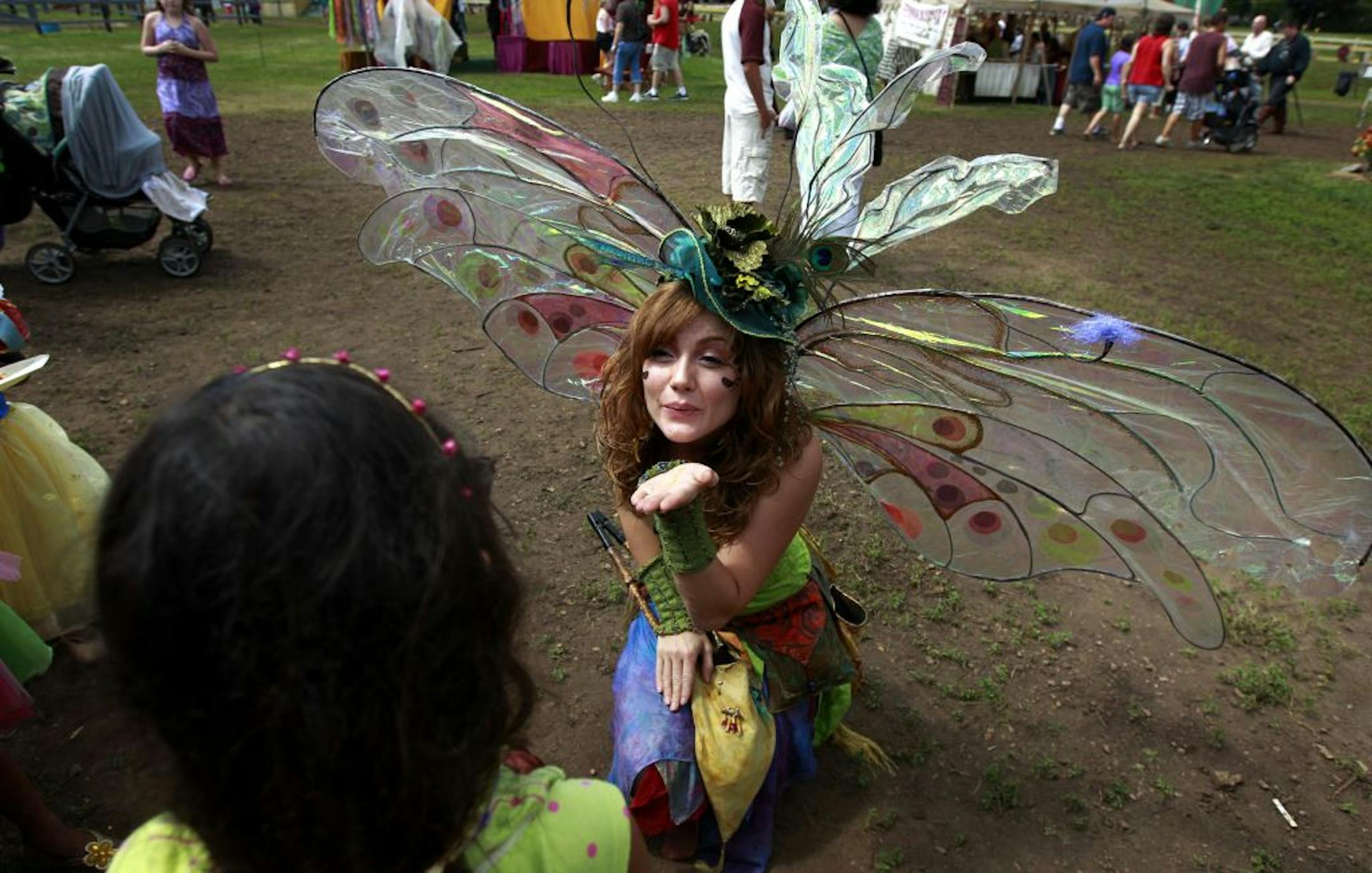 Twig the Fairy (Kathy Gfeller) blew a kiss to a young fan at the Renaissance Festival in Shakopee.