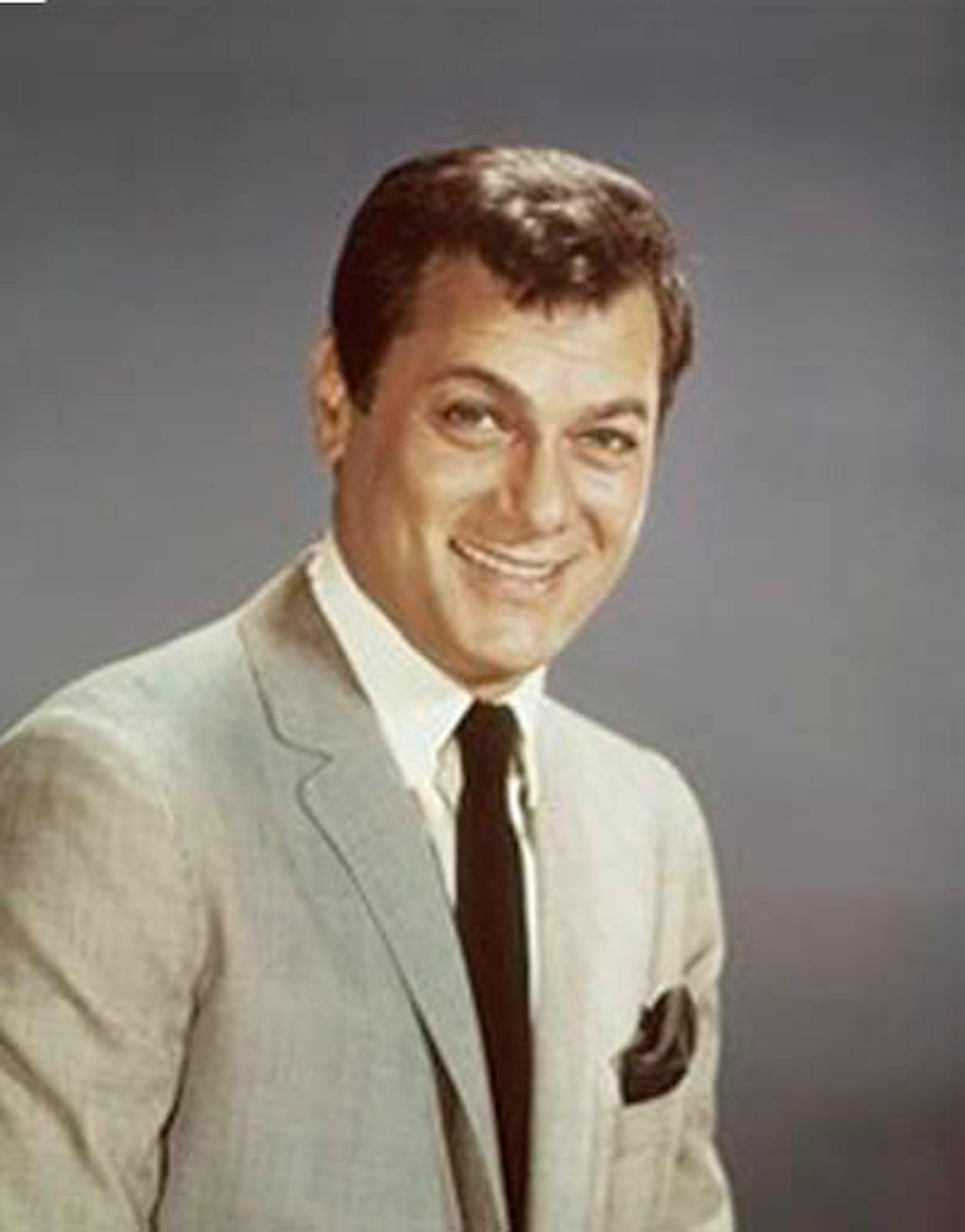 FILE - Actor Tony Curtis is shown in this 1965 file photo. Curtis, whose real name was Bernard Schwartz, was perhaps most known for his comedic turn in Billy Wilder's 'Some Like It Hot' with co-stars Marilyn Monroe and Jack Lemmon has died at 85 according to the Clark County, Nev. coroner. (AP Photo, File)