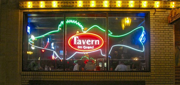 Exterior view of Tavern on Grand , Grand and Dale, St. Paul, with the neon walleye in the window ] credit Tavern on Grand