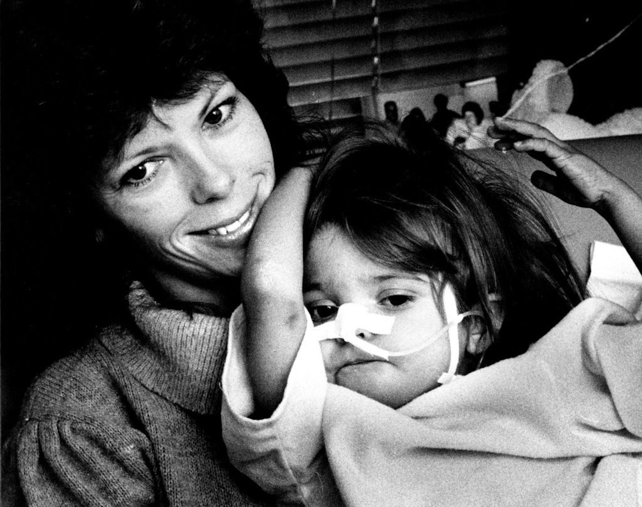 In June 1987, 23-month-old Rita Erickson, with mom Sandra, was still weak just a few weeks after liver transplant surgery.